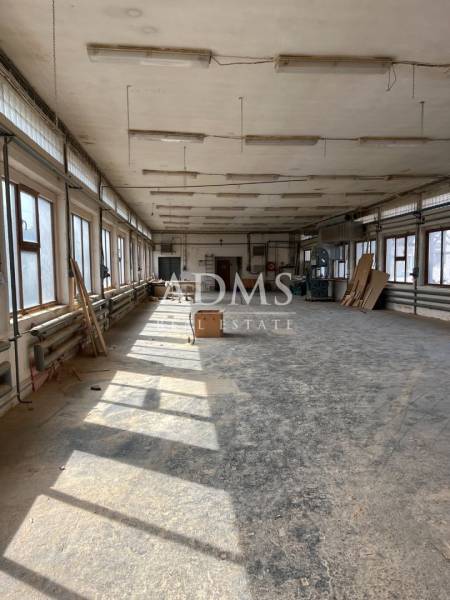 An empty space full of light with windows and a floor in warehouses and halls.