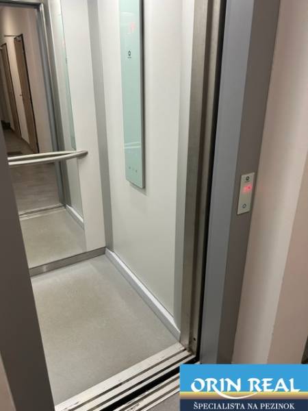 Elevator in a residential building, 2-room apartment, Za dráhou, Pezinok, open space, clean walls.