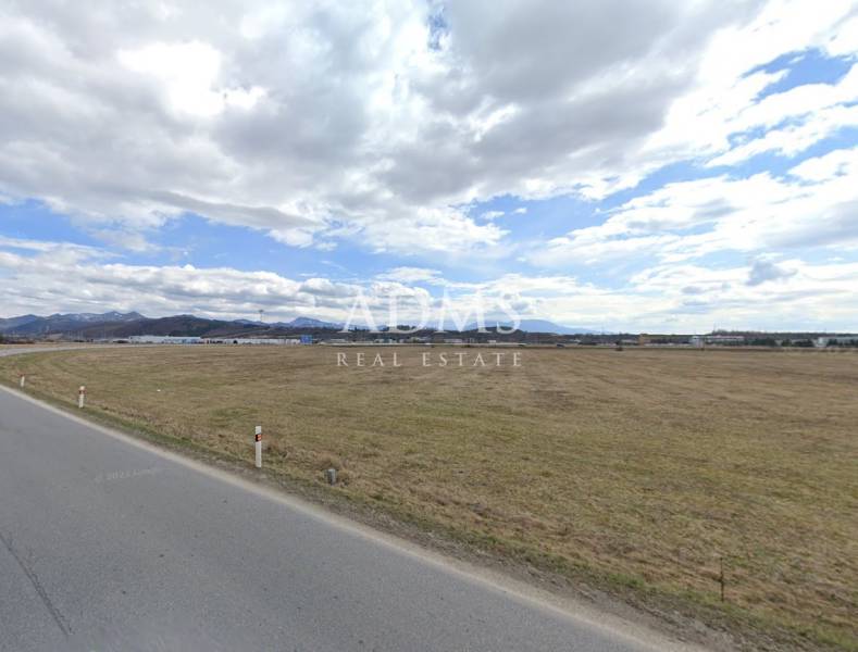 Wide flat landscape near Sučany, ideal for commercial land use.