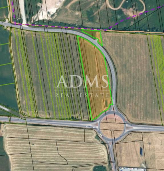Aerial view of divided agricultural land in Sučany near the roundabout.