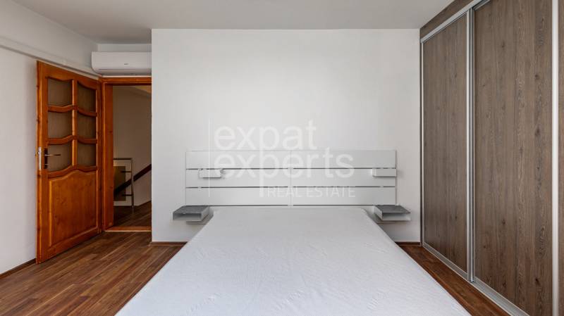 Bedroom with wooden floor and wardrobe, 5 or more room apartment.