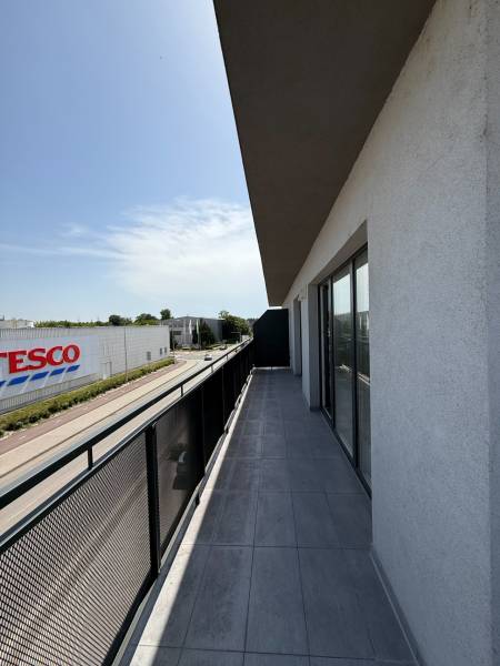Balcony of a 2-room apartment with a view of Pezinska Street in Malacky.