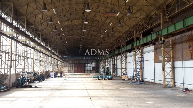 Industrial interior with iron structure and equipment in warehouses and halls.