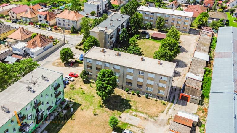 Aerial view of residential buildings and surroundings in Gabčíkovo with 2-room apartments.
