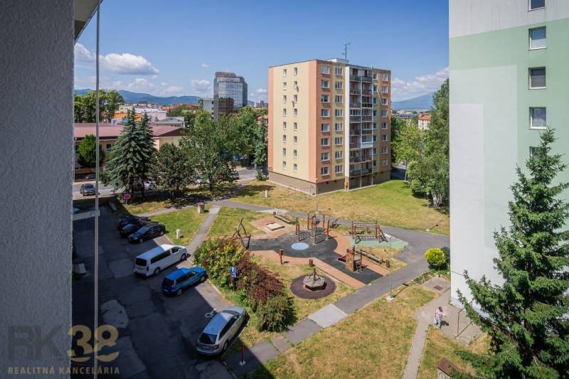 View from a 3-room apartment on Levočská Street in Poprad with a playground and parking.