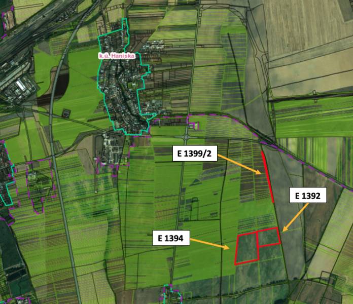 Aerial view of agricultural and forest land near Haniska, with marked parcels.