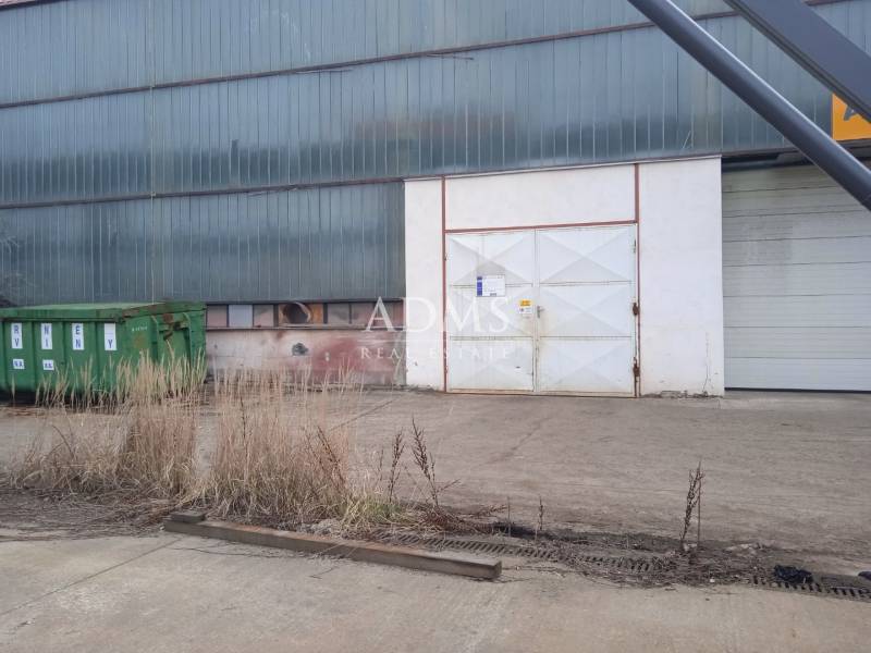 Industrial building with a slope and a container in Nové Mesto nad Váhom, warehouses and halls.