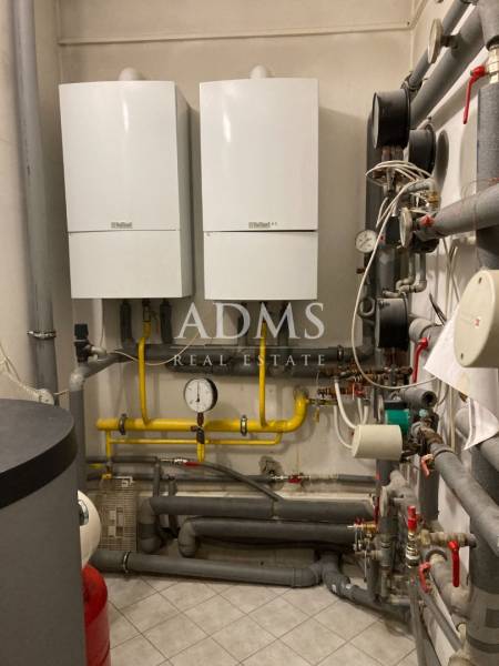 Gas boilers and pipes in the technical room of offices.