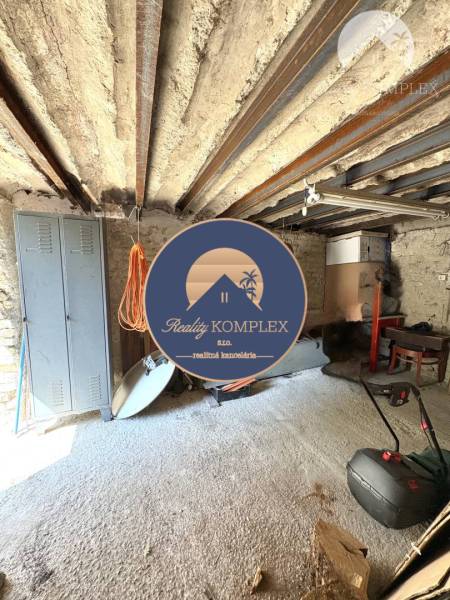 Stone interior with work tools and an iron ceiling in the cabin.