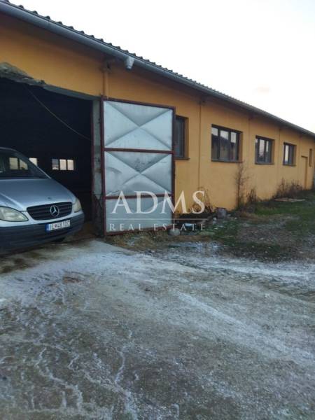 The image from Ladice shows warehouses and halls with a car at an open gate.