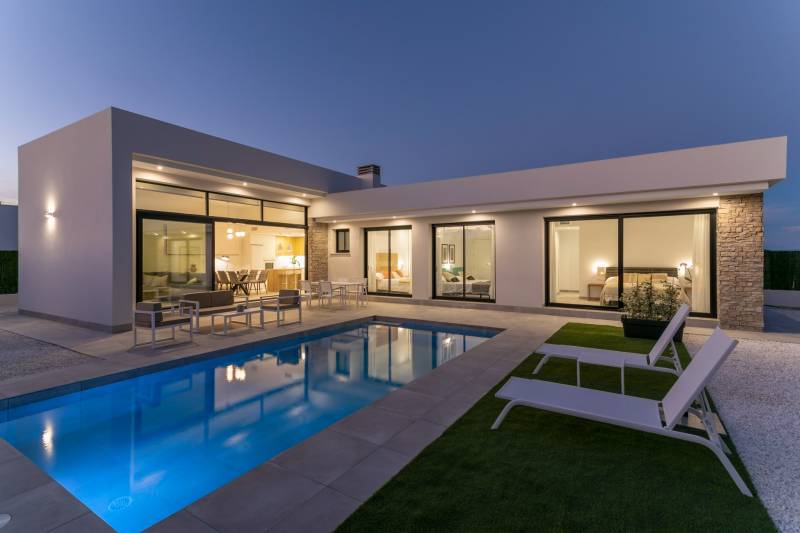 Villa in Calasparra with a pool and terrace in pleasant evening lighting.