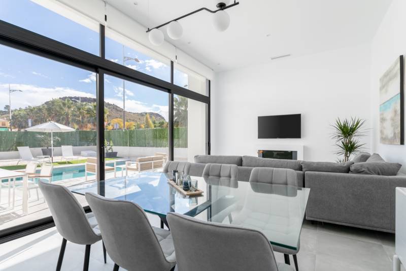 Bright living room with terrace and pool in the villa.