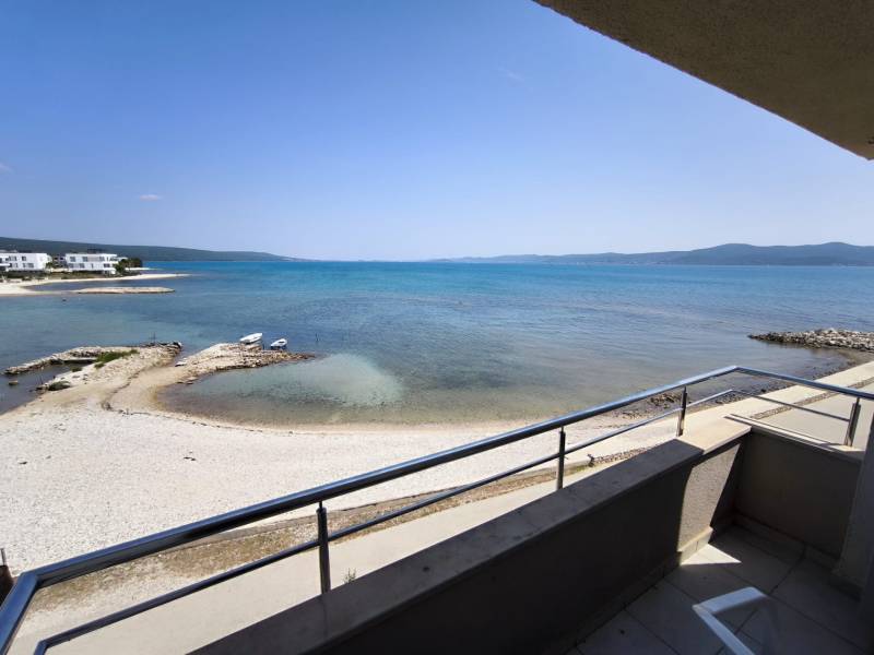 View from the balcony of a one-bedroom apartment in Sukošan with a view of the turquoise sea.