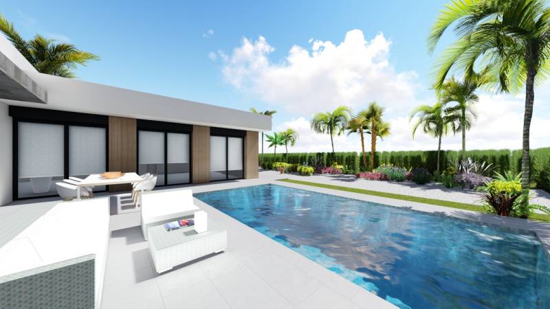 Villa in Calasparra with a pool, surrounded by palm trees and comfortable outdoor seating.