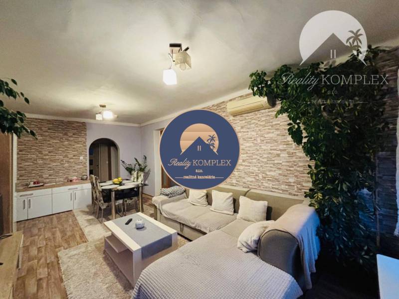 Living room in a family house, with comfortable seating and decorative elements.