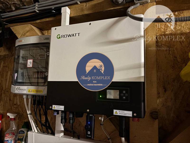 Installation of a Growatt photovoltaic inverter in a family house.