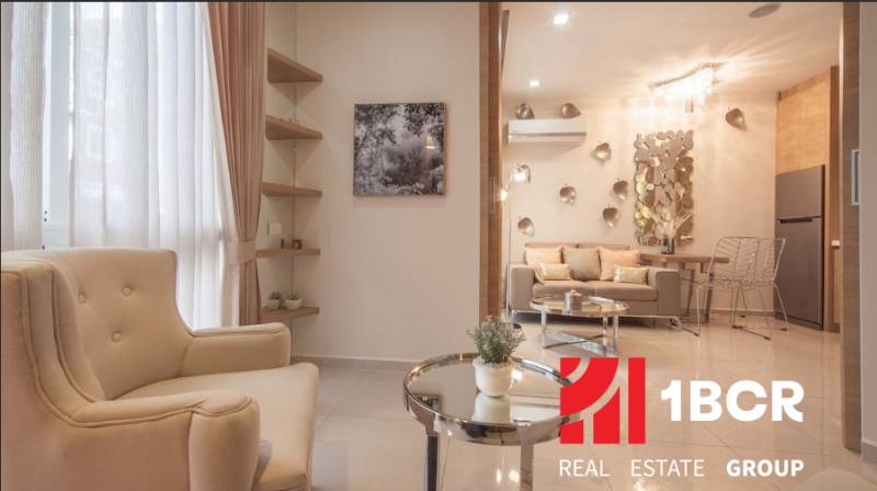 A stylish living space with a comfortable armchair and decorations in a two-room apartment.