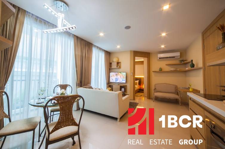 Living room in a 3-bedroom apartment with elegant furniture and a dining area.
