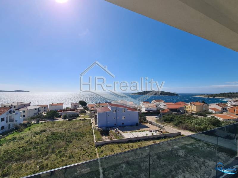A view of seaside recreational apartments in Zečevo with a view of the sea and islands.