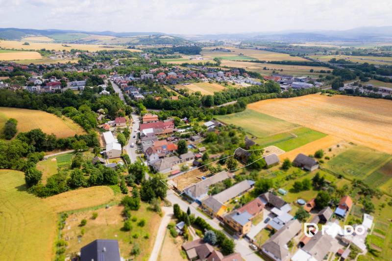 Aerial view of the village Chocholná-Velčice, surrounded by fields and residential land.