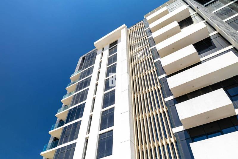 The facade of a modern apartment building in Bratislava - Staré Mesto with glass balconies.