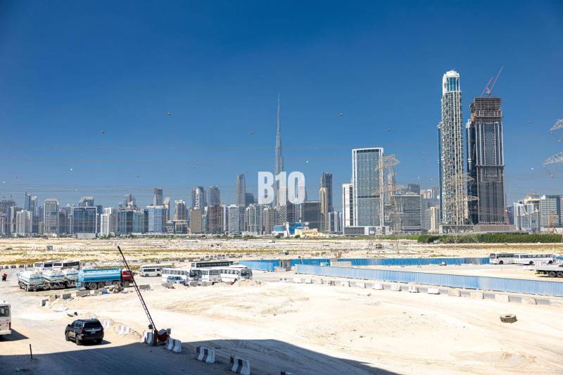 Dubai skyline with a view of skyscrapers and construction sites.