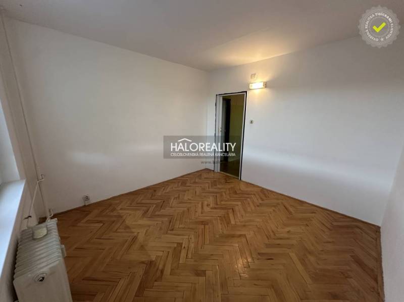 The entrance hall in a 3-room apartment with two open doors to the rooms.