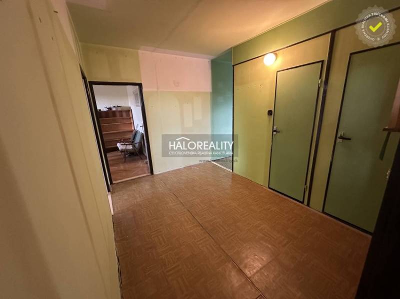 A room in a 3-room apartment with light walls and parquet flooring.
