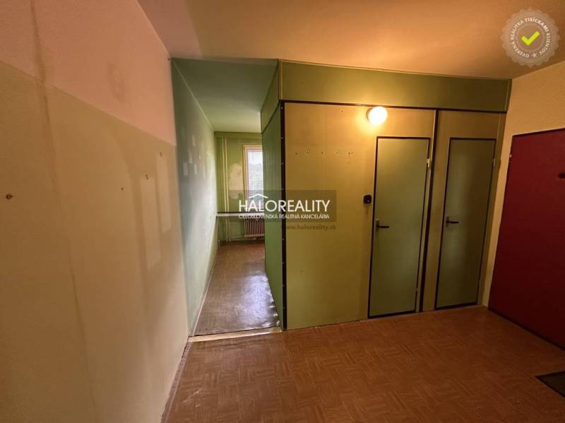 A spacious room in a 3-room apartment with parquet flooring and a large window.