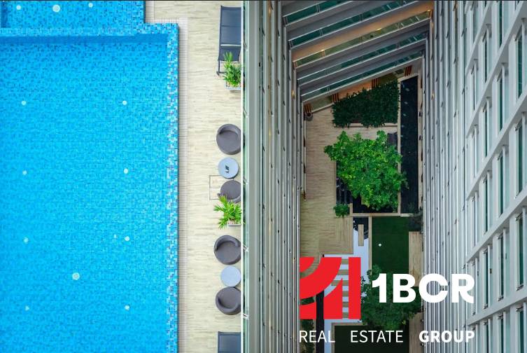 A view from above of the pool and terrace of apartment constructions in Pattaya.