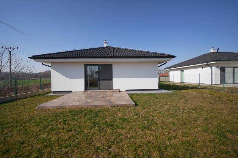 Family house on Kalinkovo Street in Rovinka with a terrace and lawn.