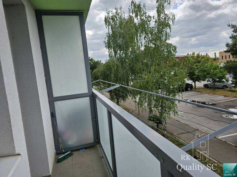 The balcony of a 2-room apartment on Žitavská Street in Senec, view of the parking lot.