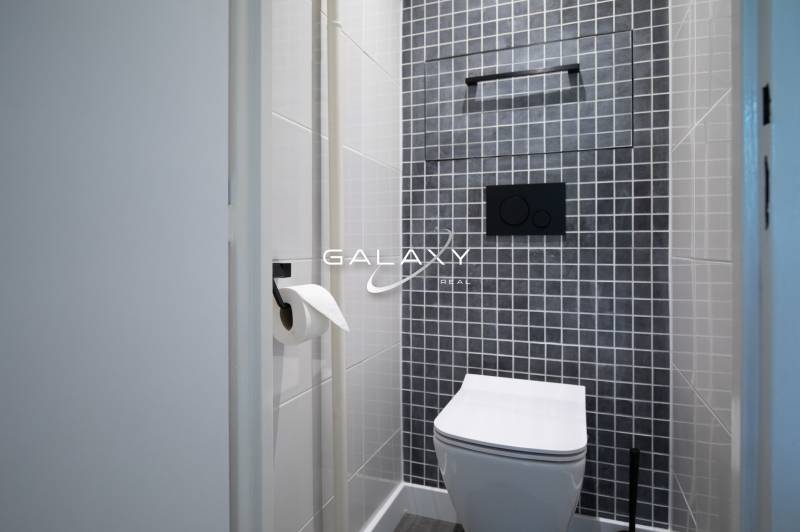 On Boriny Street, a bathroom with mosaic tiles in a 3-room apartment.