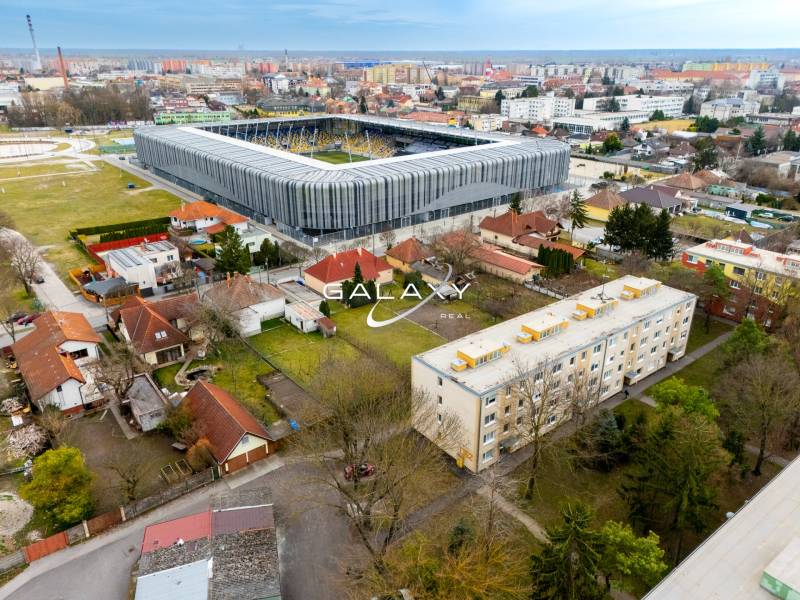In the picture is a stadium and the surroundings on Boriny Street, including 3-room apartments.