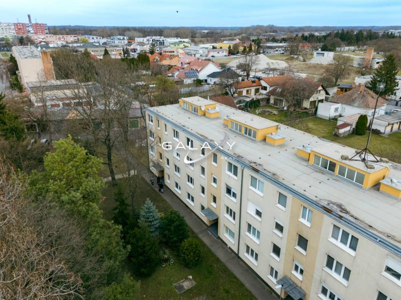 A view of the residential complex on Boriny Street, surrounded by family houses and greenery.