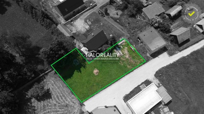 A plot for residential use in Malatíny, surrounded by buildings and nature, in a green boundary.