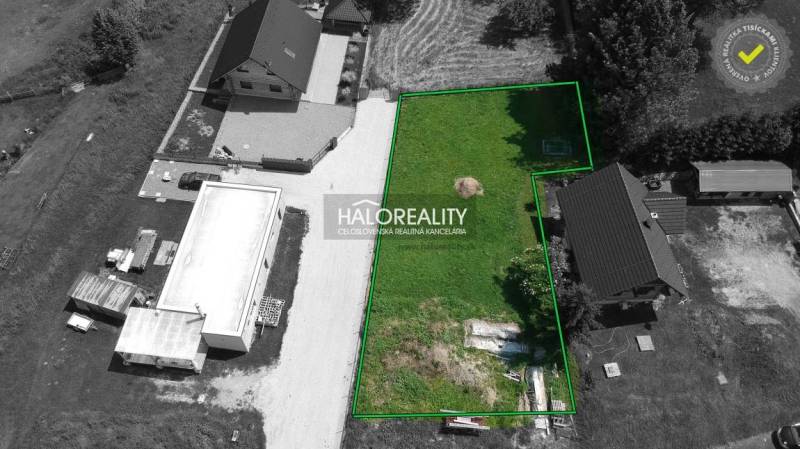 A view of a plot of land in Malatíny suitable for living, with surroundings and access road.