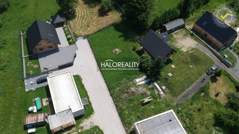 Aerial view of residential plots in Malatíny with houses and green areas.