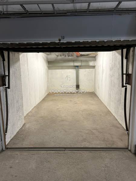 Empty garage space with concrete floor and walls, Garages.