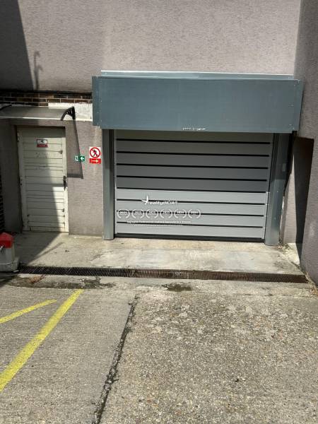 Garages on Budyšínska Street, Bratislava - Nové Mesto, with sectional doors and entrance.