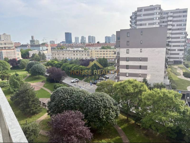 A view of the park and surrounding residential buildings in Bratislava, Ružinov district, on Jégého Street.