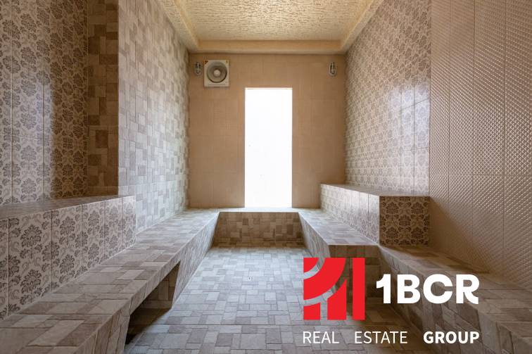 Steam sauna with tiles and seating, Apartment construction.