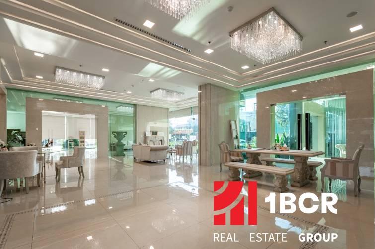 Luxurious entrance hall with marble floors and elegant furniture in the construction of apartments.