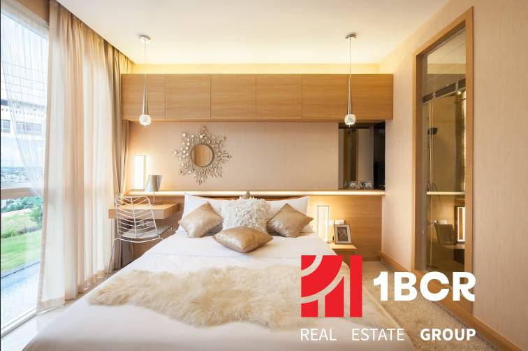 Beautiful bedroom with soft pillows in a 2-room apartment.