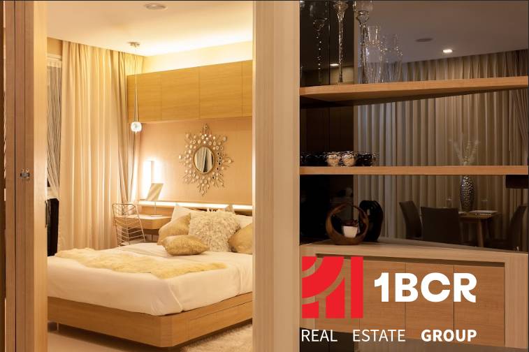 A bedroom in a 2-room apartment with wooden details and a comfortable bed.