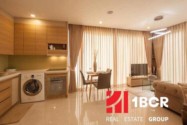 2-room apartment with a kitchen, living room, and dining area, with light-filtering curtains.