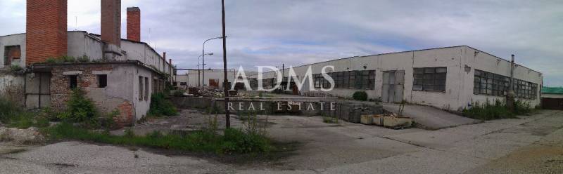 Abandoned warehouses and halls in Levice with dilapidated buildings and destroyed infrastructure.