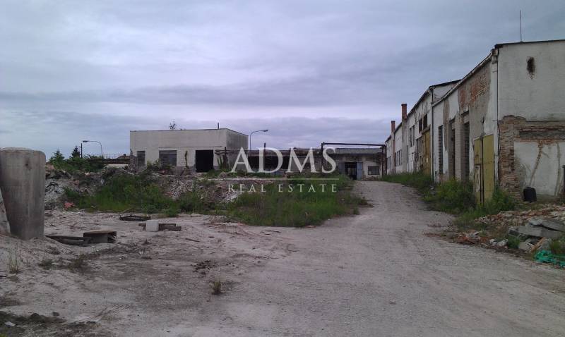 Abandoned warehouses and halls in Levice with deteriorated infrastructure and neglected surroundings.