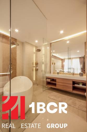 Luxury bathroom with a bathtub in a 3-room apartment, high-quality equipment and lighting.
