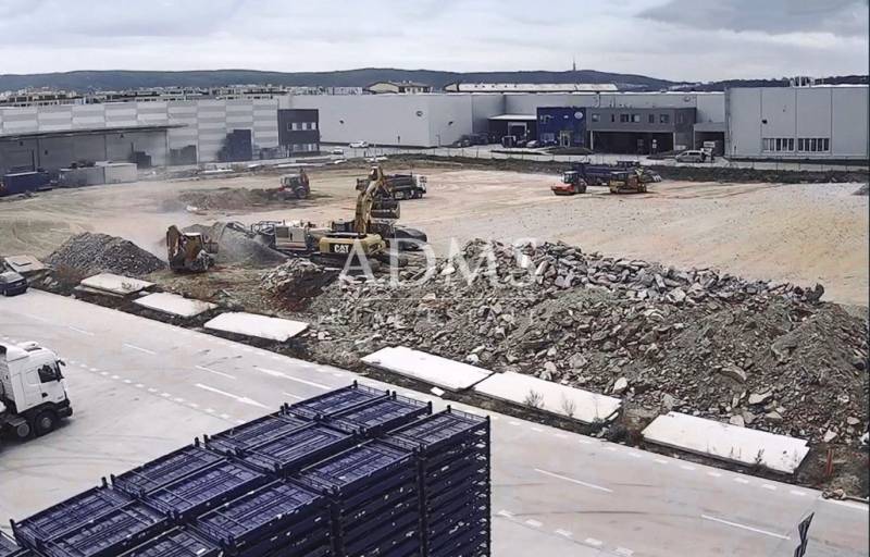 Construction site with machinery and debris in Bratislava - Devín, warehouses and halls.